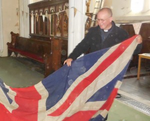 A dusty job. Peter Sutton giving me a hand packing the flag