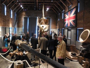 The restored conning tower of the British submarine, the E-50. In the background, HMS Iron Duke's Union Jack.