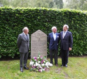 Three grandsons meet. Richard Latham and Nick Jellicoe are grandsons of Admiral Jellicoe. Max Schultz's grandson, Jürgen, stands between us his grandfather's memorial stone in Wilhelmshaven. 