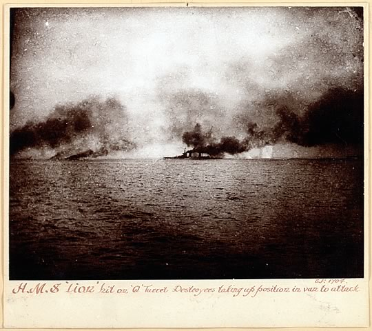 HMS Lion hit on Q turret.Destroyers taking up position in van to attack.